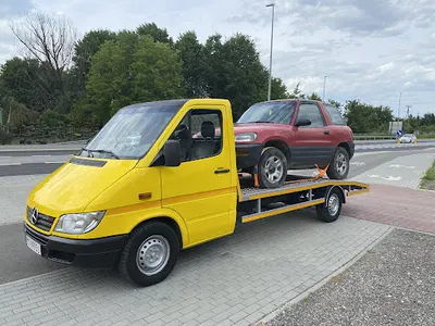 POMOC DROGOWA 24H AUTOLAWETA TRANSPORT POJAZDÓW MASZYN HOLOWANIE USŁUGI TRANSPORTOWE LAWETA